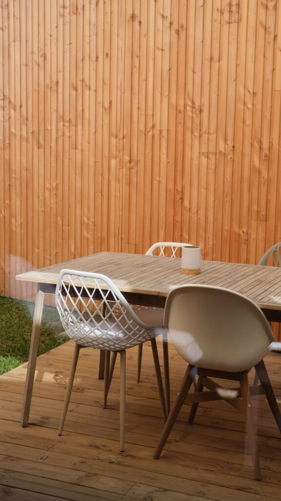 Weather-resistant outdoor table and chairs set on a patio