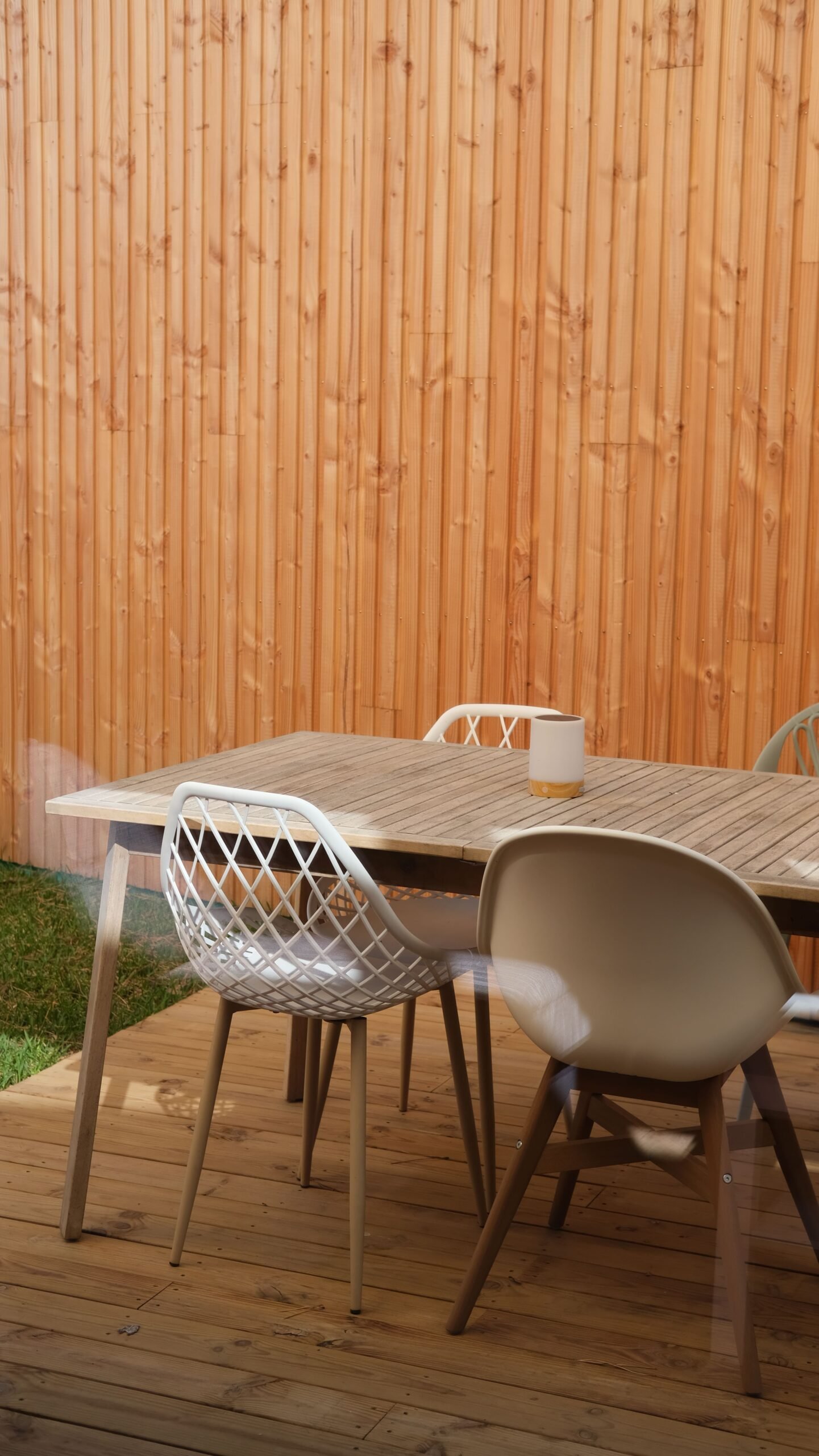 Weather-resistant outdoor table and chairs set on a patio